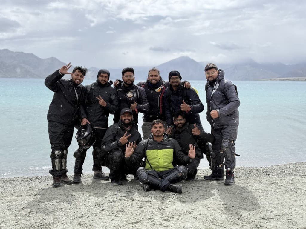 Rider group at a high-altitude lake